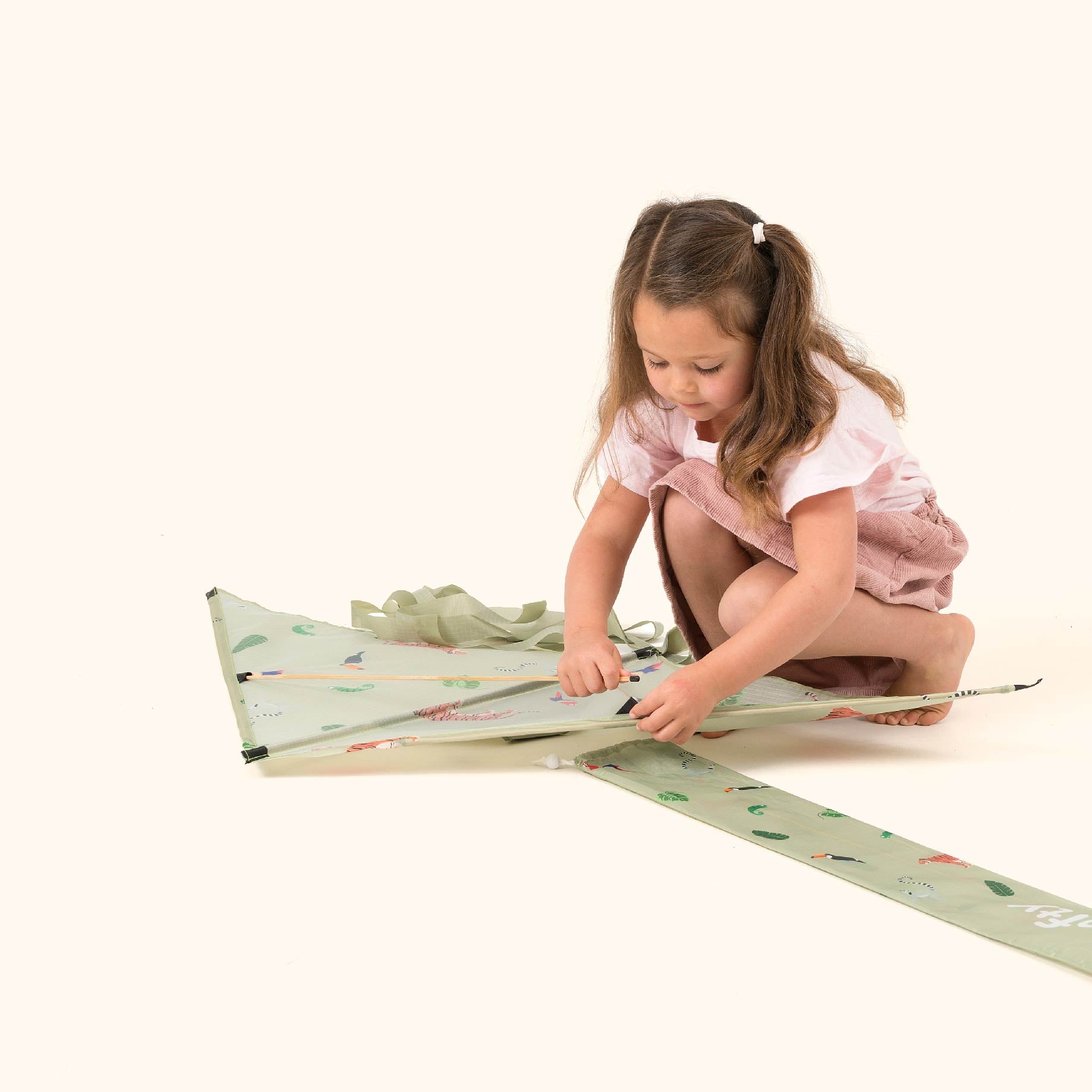 young girl fitting kite Spare Pole 